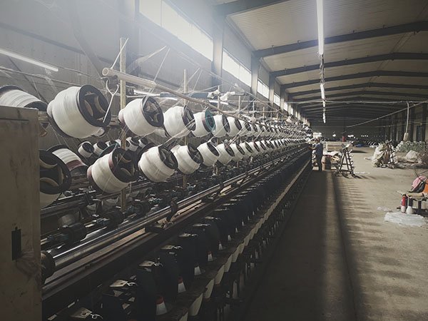 Fiberglass yarns are winded on the rollers rollers